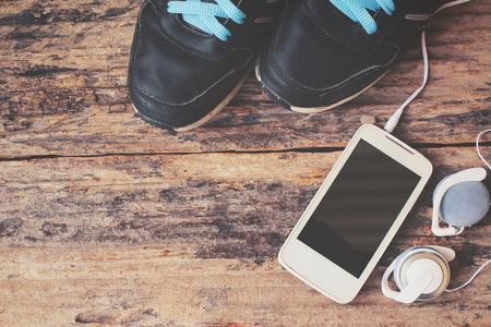 Sports shoes with smart phone and earphonesの写真素材