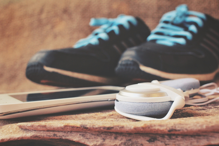 Sport shoes with smart phone and earphonesの写真素材