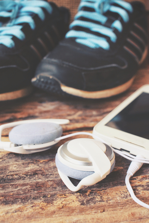 Sports shoes with smart phone and earphonesの写真素材