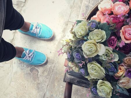 Selfie of sneakers with vintage rosesの写真素材