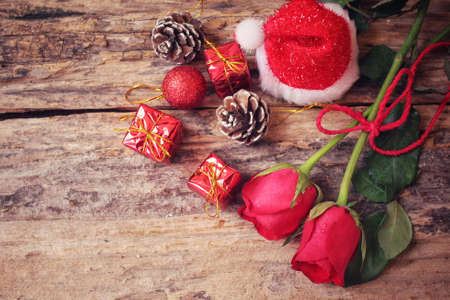 Red roses with christmas decoration and hatの写真素材