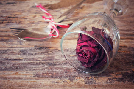 Red roses with spoon and forkの写真素材