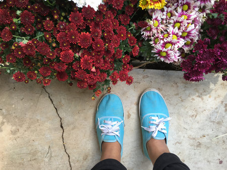 Selfie of sneakers with colorful flowers
