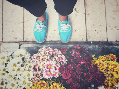 Selfie of sneakers with colorful flowersの写真素材