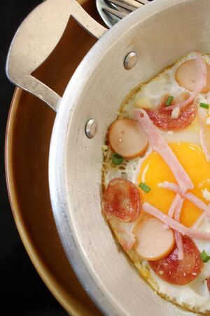 Breakfast with fried eggs on panの写真素材