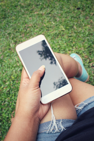 Woman using smart phoneの写真素材