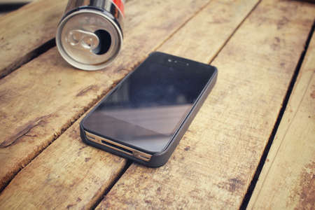 Smart phone with aluminum canの写真素材