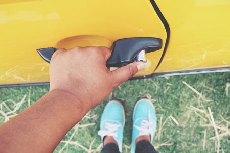Woman opens the door carの写真素材