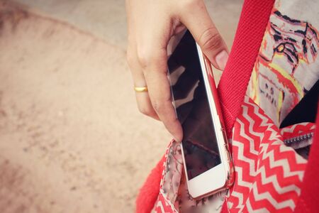 Women bag with smart phoneの写真素材
