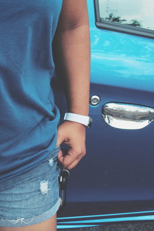 Woman with key car on handの写真素材