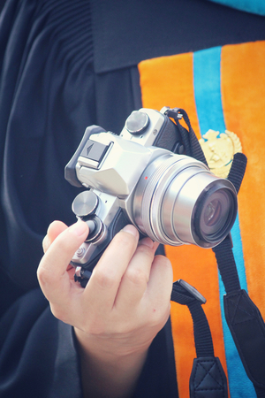 Using a camera to take photoの写真素材