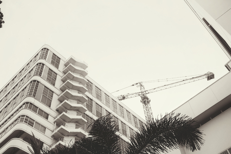 Crane with buildingの写真素材