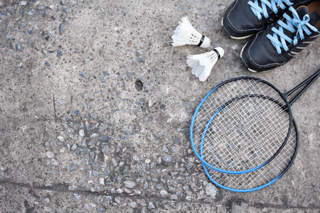 Sport shoes with shuttlecocks and badminton racket.の写真素材