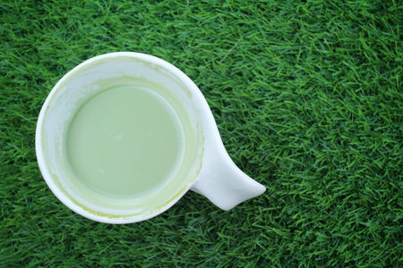 Green tea and milk on cup