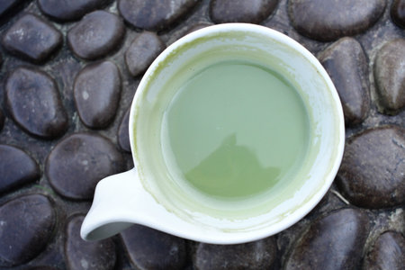 Green tea and milk on cup