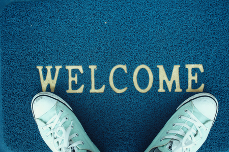 Sneakers with doormatの写真素材