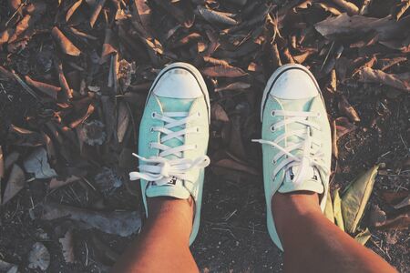 Selfie of sneakers on the roadの写真素材