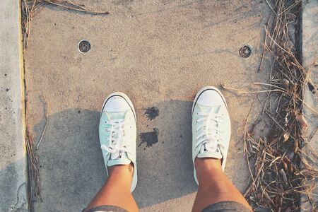 Selfie of sneakers on the roadの写真素材