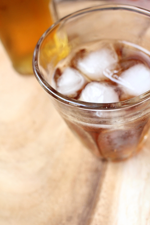 Glass of whiskey with iceの写真素材