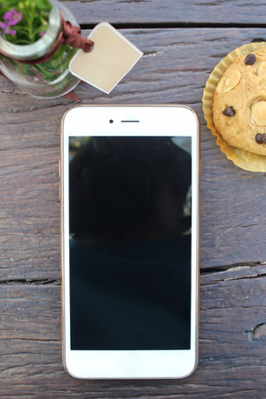 Chocolate chip cookies with smart phoneの写真素材