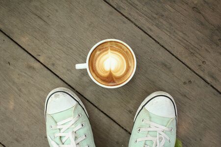 Selfie of coffee with shoesの写真素材