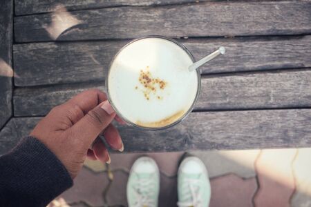 Selfie of coffee with shoesの写真素材