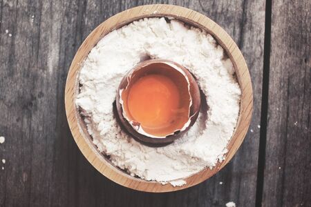 Eggs broken and flourの写真素材