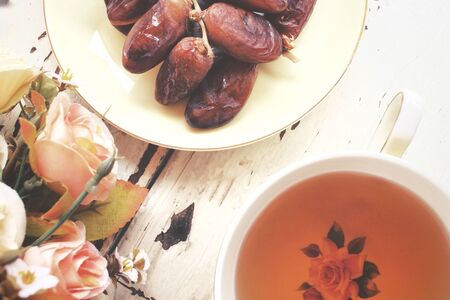 Dried date palm with hot teaの写真素材