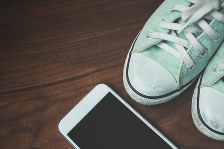 Selfie of smart phone with sneakersの写真素材