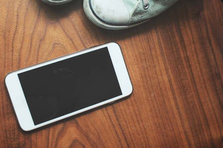 Selfie of smart phone with sneakersの写真素材