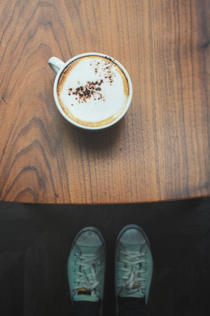 Selfie of coffee with shoesの写真素材