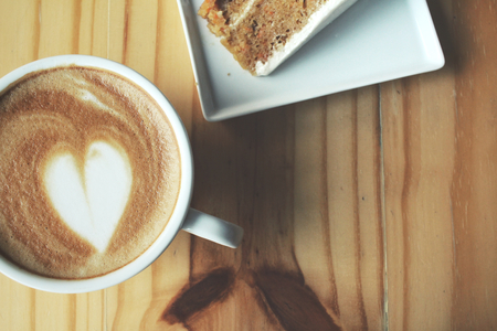 Carrot cake with coffee cupの写真素材