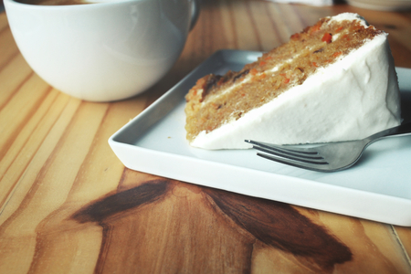 Carrot cake with coffee cupの写真素材