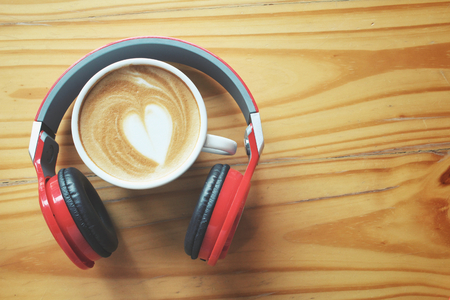 Headphones with latte art coffeeの写真素材
