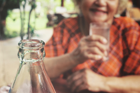 Senior drinking waterの写真素材