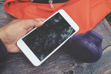Woman using  speaker with smart phone