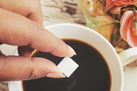 Sugar cubes with black coffeeの写真素材