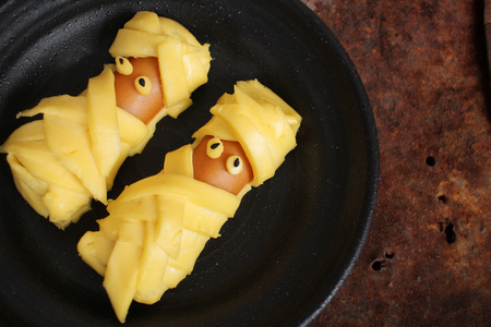 Mummy of cheese with sausage in halloween dayの写真素材