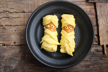 Mummy of cheese with sausage in halloween dayの写真素材