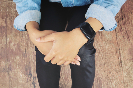 Smartwatch on hand with jeans jacketの写真素材