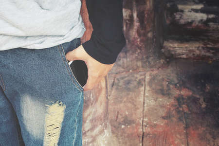 Smart phone in jeans pocketの写真素材