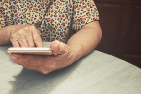 Senior woman using smart phoneの写真素材