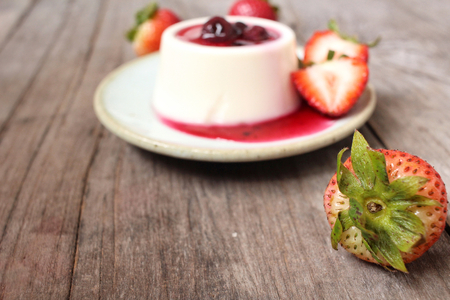 Panna cotta with blueberries jam and strawberriesの写真素材