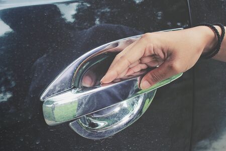 Woman opens the door carの写真素材