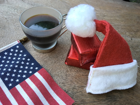 American flag with christmas hat and coffee cupの写真素材
