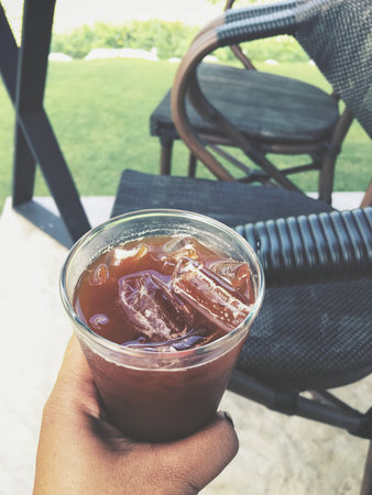 Selfie of iced coffee on hand