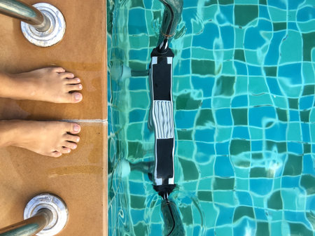 Selfie of foot with wimming pool and stair