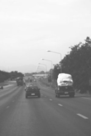 Blurred of car on road