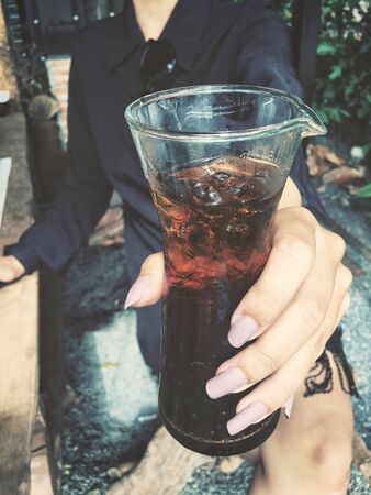 Cola with ice cubesの写真素材