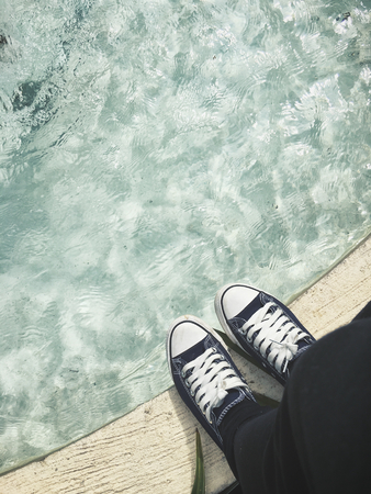 Selfie of sneakers on poolの写真素材